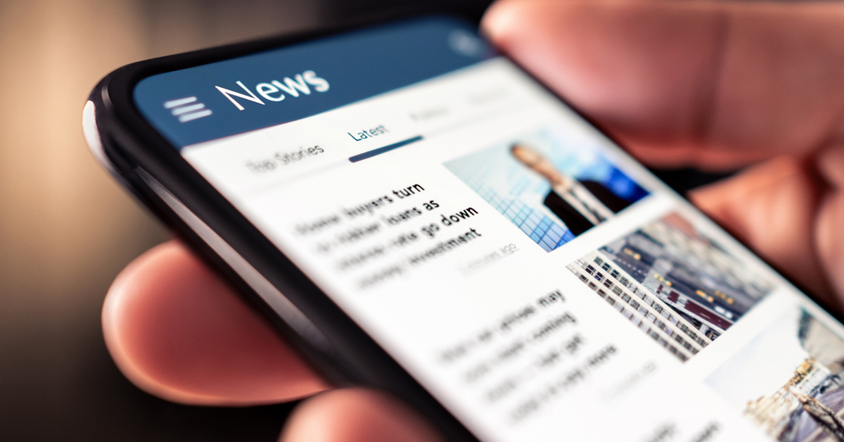 a hand holding a cell phone