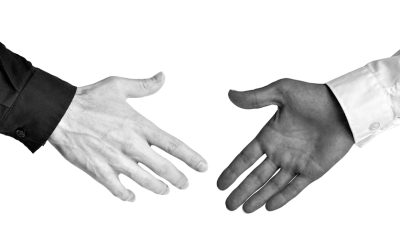 A Man Wearing A Suit And Tie